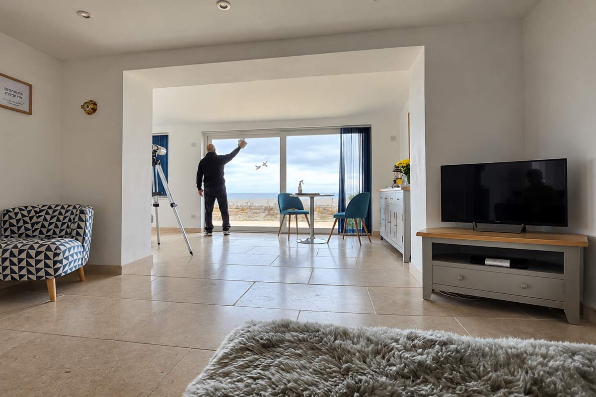 Cleaner working in a bright property in Dorchester