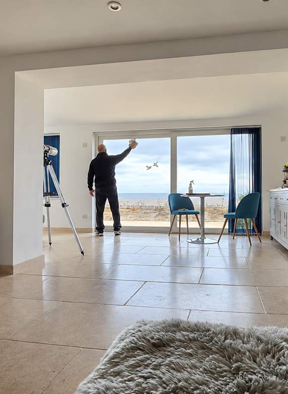 Cleaner working in a bright property in Dorchester