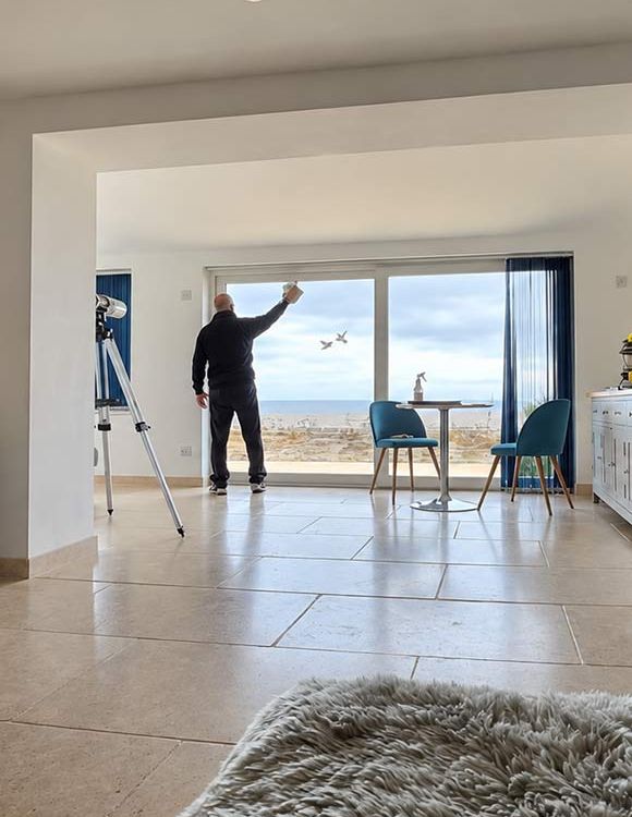 Cleaner working in a bright property in Dorchester